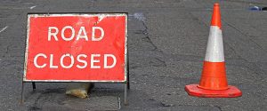 Road Closed sign with traffic cone